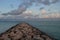 Pink Clouds Over a Rock Jetty Coastal Aruba