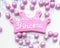 Pink color crown shaped Cookie with princess written on it with white fondant