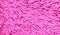 Pink colored fabric texture background.