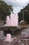 Pink coloured water flowing through a fountain