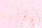 Pink confetti and stars and sparkles on pink background