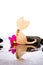 Pink Cosmos Flowers and burlap cat shape on black massage rocks