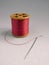 Pink Cotton reel, thread and needle