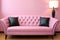 A pink couch with black pillows and a lamp. Generative AI image.