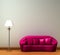 Pink couch with standard lamp