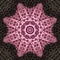 Pink crochet on gray kaleidoscopic starburst
