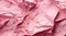 Pink crumpled paper texture abstract background