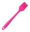 Pink culinary brush, kitchen utensil. Isolated background