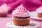 Pink cupcake on barbie pink background