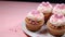 Pink cupcake with icing, a sweet celebration generated by AI