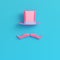 Pink cylinder hat with fake mustache on bright blue background i