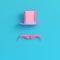 Pink cylinder hat with fake mustache on bright blue background i