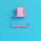Pink cylinder hat with fake mustache on bright blue background i
