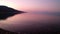 Pink Dawn Light on Calm Gulf of Corinth Bay