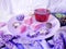 On a pink dish, sweets, chocolate cookies, tea, on the table decor of Christmas tree decorations, fluffy scarf, felt hearts