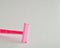 A pink disposable razor