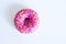Pink donut on a white background