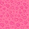 Pink doodle hearts vector seamless pattern