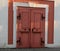 Pink door with ironwork