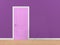 Pink door isolate on purple wall background