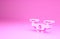 Pink Drone flying icon isolated on pink background. Quadrocopter with video and photo camera symbol. Minimalism concept