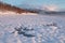 Pink early morning glow light on snow covered mountains in arctic norway, super wide panoramic scene. Scenic winter view