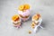 Pink easter cakes decorated by ribbons and orange chips