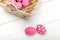 Pink Easter eggs on wodden background. Still life photo of lots of pink easter eggs. Copyspace.