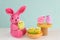 Pink Easter rabbit Colorful chicks basket Pastel colors