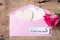 Pink envelope, heart and pink rose with I Love You Mom card