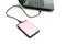 Pink external hard-disk on white