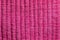 Pink fabric sewn lengthwise