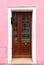 Pink facade retro entrance door