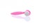 Pink facial cleansing brush on white background. Face massage, skincare tools