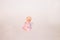 Pink fairy figurine on a white background