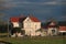 Pink farmhouse with red roof