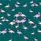 Pink flamingos on a dark green background. Seamless patern.
