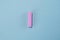 Pink flash lie on pastel blue background. Minimal summer concept