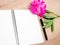 Pink floral assorted pink flower on wooden background with notepad free space, copy space for tekst