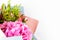 Pink flower bouquet on a white background. in gift wrapping. Place for an inscription. Easy to cut. View from above. close-up