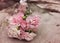 pink flower bouquet on wooden background