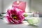 Pink flower eustoma and candle in the background