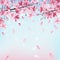 Pink flowering cherry branch and blue sky