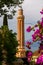 Pink flowers with Alaaddin or Yivliminare Mosque. Antalya, Turkey