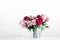 Pink flowers. Curly peony ranunculus in Metallic gray watering can,empty space