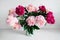 Pink flowers. Curly peony ranunculus in Metallic gray watering can,empty space