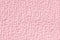 Pink fluffy background of soft, fleecy cloth. Texture of textile closeup