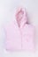 Pink folded hooded baby cloth.