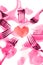 Pink forks surrounding heart shape and rose petals