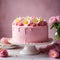 Pink frosted cake with flowers